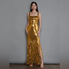 An Ankle Length Adjustable Spaghetti Straps Tassel Dress Made From A Shinny Gold Sequins Dress, Featuring A Fitted High Waist, And A Square Neck And Back Line Design. This Is A Classic Party, Evening, Cocktail And Prom Dress. Can Be Paired With A Solid Color Jacket Or Blazer. Available Sizes: Us 2, 4, 6 & 8 #Gold #Sequins #Shinny #Tassel #Dress #Promdress #Partydress #Cocktaildress #Luxury #Fashion Gold Sequin Dress Outfit, Gold Dress Long Classy, Elegant Gold Dress, Sparkly Gold Dress, Wedding Afterparty, Gold Sequins Dress, Girlfriend Outfits, Gold Dresses Long, Gold Evening Gown