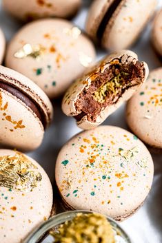 there are many macaroons that have sprinkles on them