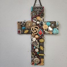 a cross made out of beads and other items