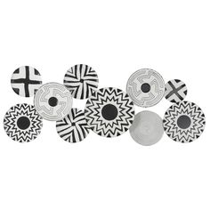 six black and white plates with designs on them, all in different shapes and sizes