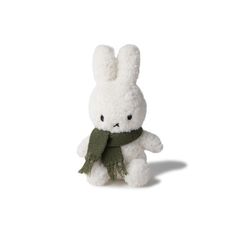 a white stuffed animal with a green scarf around it's neck