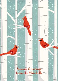 two red birds are perched on the branches of birch trees and snow is falling down