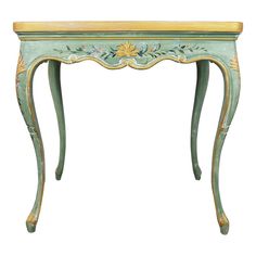 an antique console table painted in green and yellow