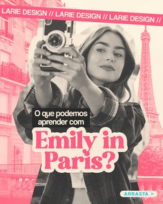 a woman holding a camera in front of the eiffel tower