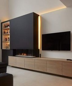 modern living room with fireplace and built - in entertainment center