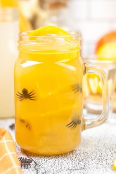 a mason jar filled with lemonade on top of a table