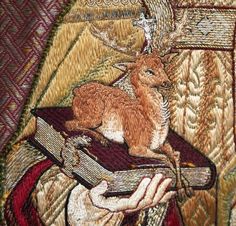 a close up of a tapestry with a deer on it's shoulder and a person holding a guitar