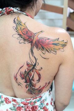 a woman with a bird tattoo on her back