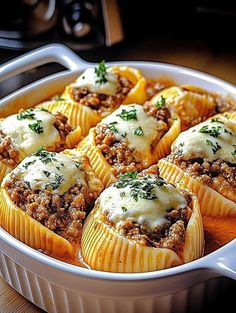 a casserole dish filled with meat and cheese