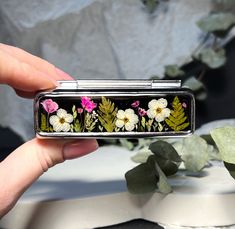 Handmade  lipstick case with real pressed dried flowers. I use only real flowers. Each product is UNIQUE. This case will be a lovely gift for you or your loved ones. I pick up all  flowers in my garden or forest by myself. Then I dry them in handmade press for several weeks. And only after that I make compositions on cases. Each flower is unique - each box is unique. Metal   box with real dried flowers, filled with quality resin. The body of the box is made of metal with a latch  Lattice is in t Handmade Lipstick, Lipstick Case, Vanity Storage, Pressed Flower Art, Lipstick Holder, I Pick, Toiletry Storage, Pressed Flower, All Flowers