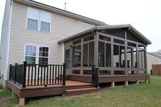 a house with a screened porch and stairs