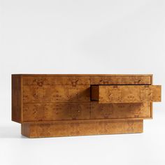 Prized for its fascinating array of whorls and knots, burl wood brings the drama to our stunning Ambrose dresser. Broad planes, flat-front drawers and a pronounced plinth base showcase the unique markings while creating a striking minimalist silhouette. Small knob pulls accent the six drawers with hand-forged texture and the warm glow of burnished brass. A statement-maker on its own, the dresser amps up the impact when paired with our coordinating Ambrose canopy bed and nightstand.   • FSCr-cert Bed And Nightstand, Dorm Shopping, Interior Design Classes, Redwood Burl, Class Pictures, Minimalist Silhouette, Burnished Brass, Burl Wood, Canopy Bed