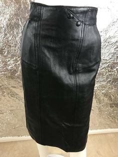 Women's vintage 1980's genuine black fitted leather high waist pencil skirt with back zipper.  Has side front pockets, full lining, and a back slit.  Size 8 (vintage sizing runs smaller than modern sizing) or small to medium, has NO stretch.  Pre-owned.  Good vintage condition.  WAIST=26 inches.  HIPS=36 inches.  ZIPPER LENGTH=9 inches.  SLIT LENGTH=8 inches.  LENGTH=26 inches. I Am Poison, High Waist Pencil Skirt, High Waisted Pencil Skirt, Black High Tops, Black Pencil Skirt, Black Pencil, Hair Colorist, 1980s Vintage, Black Fits