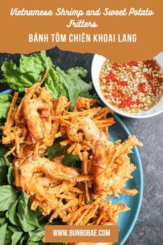 vietnamese shrimp and sweet potato fritters on a blue plate with garnishes