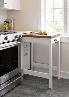 a kitchen with an oven, sink and countertop in it's center island