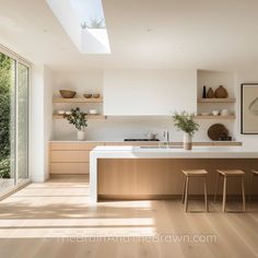 the kitchen is clean and ready to be used for cooking or eating, with plenty of natural light coming in from the windows