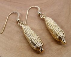 "If she loves the beauty of corn this would be a very unique corn gold dangle earrings gift for her, or for someone who is a member of the corn grower association, or a corn farmer. This piece is my 14kt gold vermeil large all gold ears of corn with the corn cobs showing in front and the corn husk still tight on the cob. This is a very simple and recognizable ear of corn design with amazing three-dimensional detail. I have hand engraved lines on the surrounding corn husk to give it very fine det Corn Design, Ear Of Corn, Corn Cob, Ears Of Corn, Corn Husk, Gifts For Farmers, Corn On Cob, French Wire, Small Rings