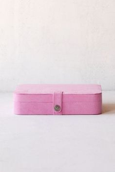 a pink box sitting on top of a white table