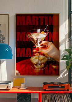 there is a martini poster on the wall