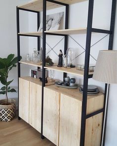 the shelves are made out of wood and have black metal trimmings on them