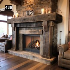 a living room with a fire place next to a couch and chair in front of a fireplace