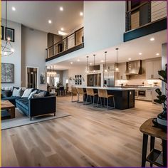 a living room filled with furniture next to a kitchen and an open concept floor plan