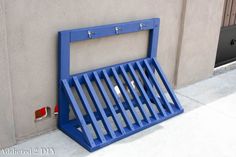 a blue rack on the side of a building