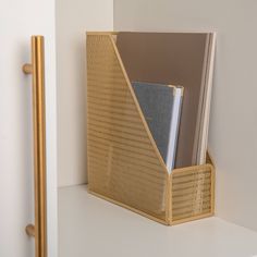 a close up of a book holder on a shelf