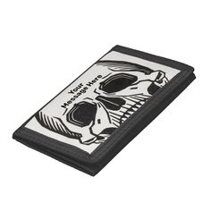 a black and white wallet with a skull on it