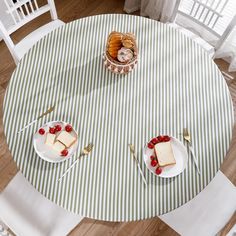 two plates with slices of cake on them sitting on top of a table next to each other