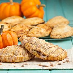 some pumpkin pies and cookies on a table