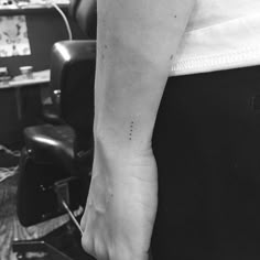 black and white photo of a person's foot with the word love on it