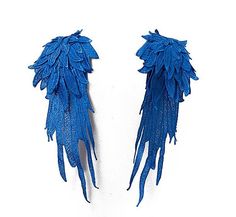 two pairs of blue feathers on a white background