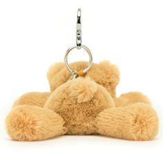 a teddy bear keychain is shown on a white background