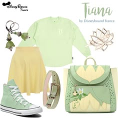 there is a green shirt and yellow skirt with white shoes on it, along with other items