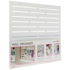 the wall organizer is white and has five compartments