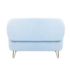 a light blue couch sitting on top of a white floor