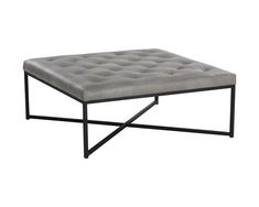 a gray ottoman sitting on top of a metal frame