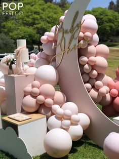 an outdoor event with balloons and decorations