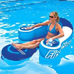 a woman is sitting on an inflatable pool float