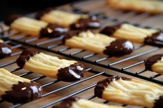 chocolate covered cookies cooling on a rack in a bakery oven, ready to be eaten