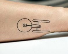 a small tattoo on the arm of a person