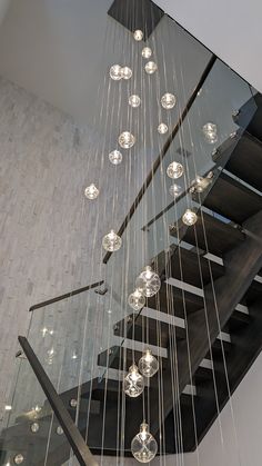 a staircase with glass balls hanging from it