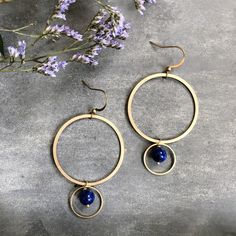 "Handmade in Philadelphia. Color : Blue/ Gold. Natural Lapis Lazuli beads, Brass. Measure approx. 2-3/4\"L x 1.5\"W. If you are looking for different gemstones /beads or large quantities, please, send me a message.  Custom Orders Welcome:)" Blue Brass Beaded Dangle Earrings, Blue Beaded Brass Dangle Earrings, Blue Dangle Beaded Brass Earrings, Blue Beaded Dangle Earrings In Brass, Blue Beaded Circle Jewelry, Blue Small Hoop Jewelry With Dangling Beads, Blue Metal Jewelry, Blue Small Hoop Earrings With Dangling Beads, Blue Brass Hoop Jewelry