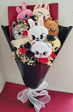 a bunch of stuffed animals in a vase