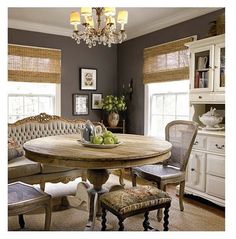 a dining room table and chairs with an advertisement on the wall