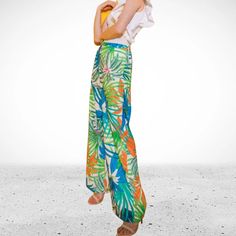 These tropical print pants are ready for your next vacation! Features a wide leg and back elasticized waistband Material100 % Polyester Floral Print Ankle-length Wide Leg Vacation Pants, Multicolor Wide-leg Beach Pants, Multicolor Wide-leg Pants With Bold Print, Non-stretch Printed Pants For The Beach, Beach Floral Print Wide-leg Pants, Print Pants, Pants Large, Printed Pants, Tropical Print