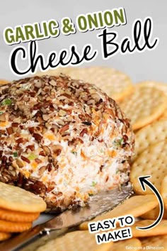 garlic and onion cheese ball on a platter with crackers next to it that says garlic & onion cheese ball easy to make