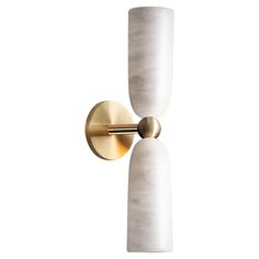 two white and gold wall sconces with one light on the left hand side