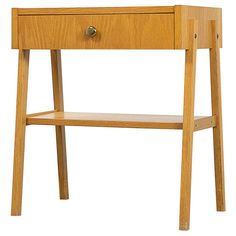 a wooden table with a drawer on the top and bottom shelf below it, against a white background